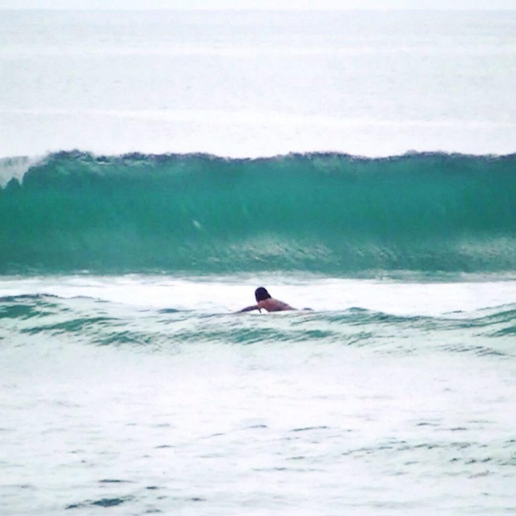 Paddling out to catch a wave, photo credit buddimana.